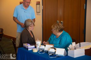 Audience member getting health screening