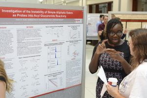 Aishat presenting her poster at 2015 Project SEED poster session