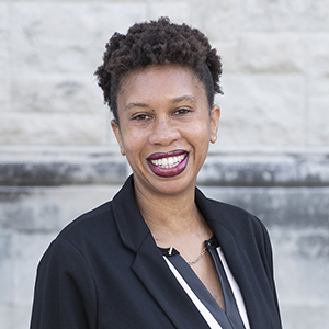 Cydne Perry smiles in a headshot.