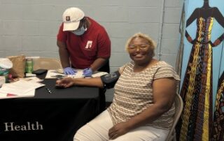 Woman having blood pressure taken