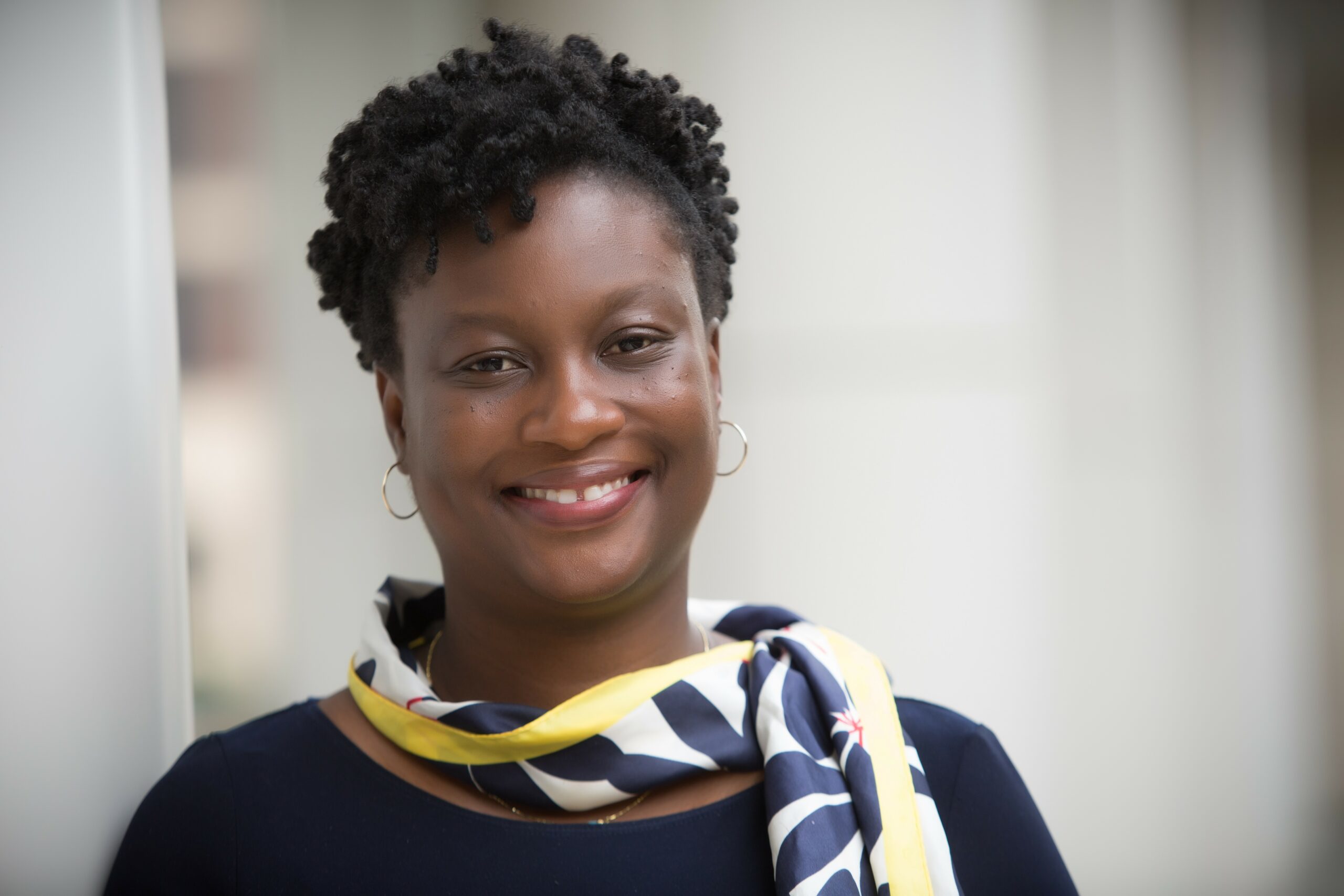 smiling headshot of Temitope Erinosho, PhD.