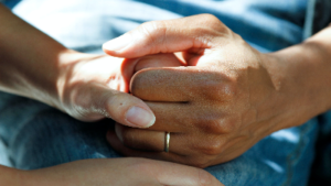photo of two hands holding hands
