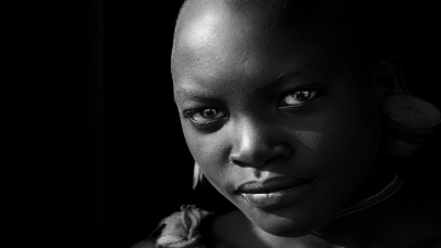 black woman staring down the camera confidently