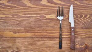 empty table with fork and knife