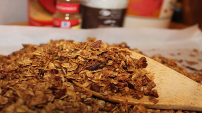 wooden spoon holding granola