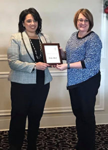 tisha receiving award